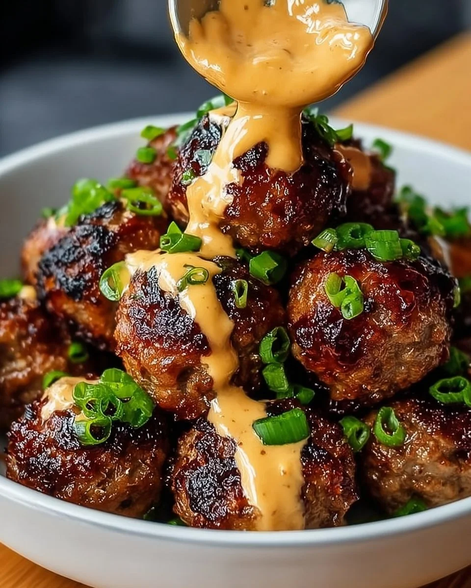 Savory Korean BBQ meatballs paired with spicy mayo dip on a platter